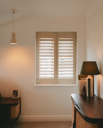 UK made shutters in bedroom.webp
